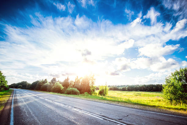 istock Sunrise beautiful road in forest 1723716978