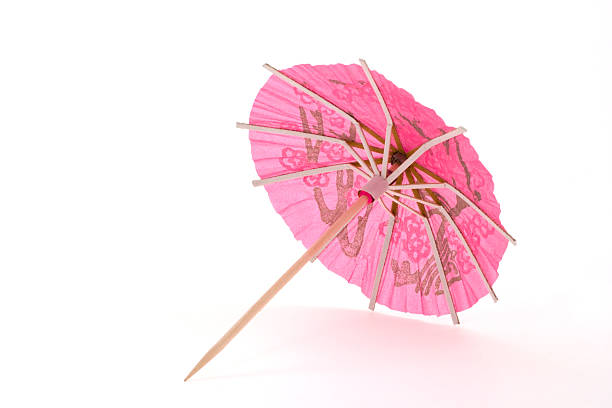 rosa ombrellino da cocktail - drink umbrella umbrella parasol drink foto e immagini stock