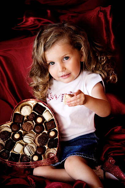 girl with chocolates stock photo