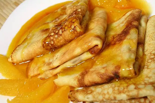 French pancakes with a thick and sweet orange sauce