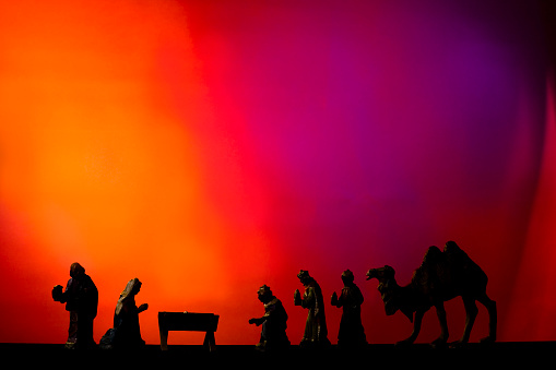 Three wisemen visiting the Nativity with Mary, Joseph and Baby Jesus in the Manger. Camel.. Silhouette. Christmas.