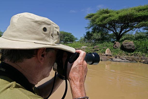 istock Senior man takes photo's on Safari 172373280