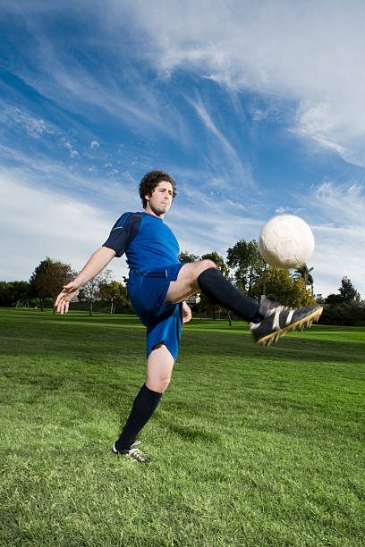 istock Soccer Player Kicking Ball 172373394