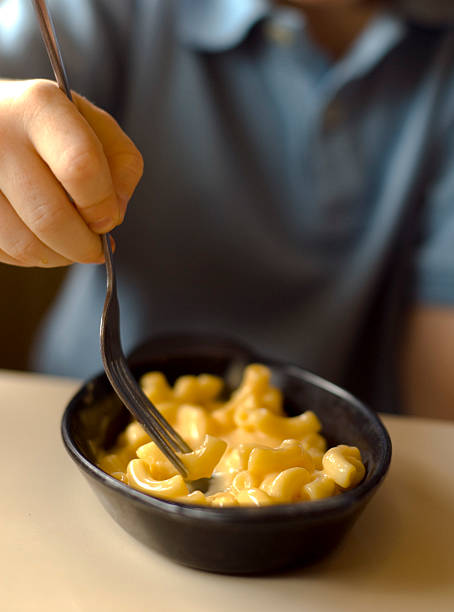 istock Boy Eating Pasta, Child Eats Macaroni & Cheese Lunch 172374409