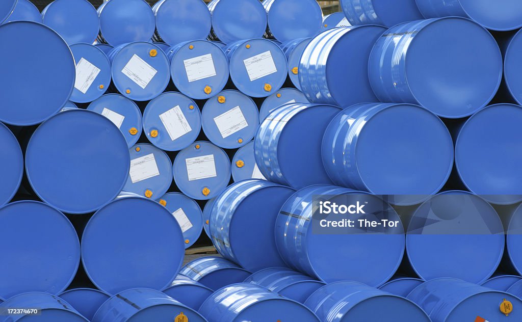 A warehouse full of blue Hugh barrels  A pile with blue barrels. Barrel Stock Photo