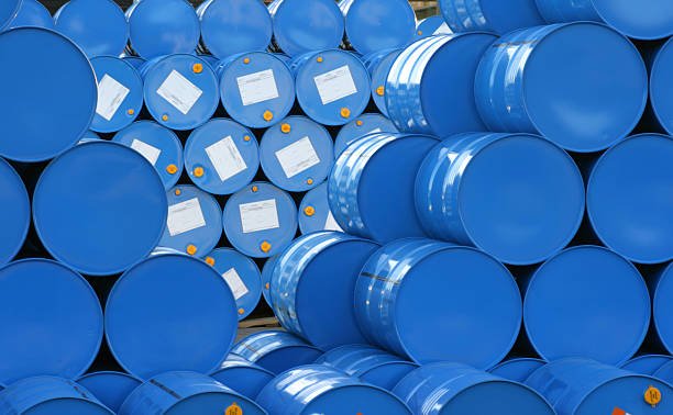 A warehouse full of blue Hugh barrels  A pile with blue barrels. drum container stock pictures, royalty-free photos & images