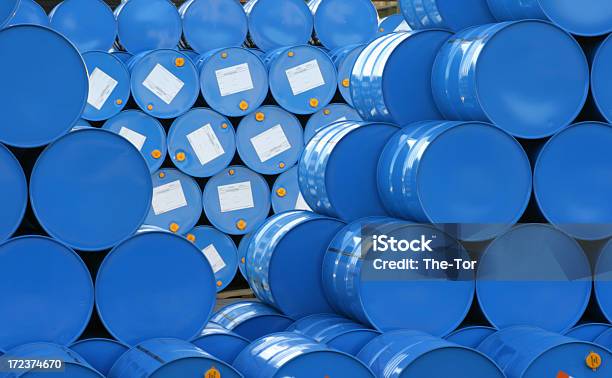 A Warehouse Full Of Blue Hugh Barrels Stock Photo - Download Image Now - Barrel, Chemical, Crude Oil