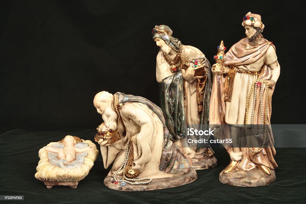 Religious: Christmas Nativity with Wise Men and baby Jesus 3 beautifully decorated ceramic wise men offering gifts to the infant Jesus. Adult Stock Photo