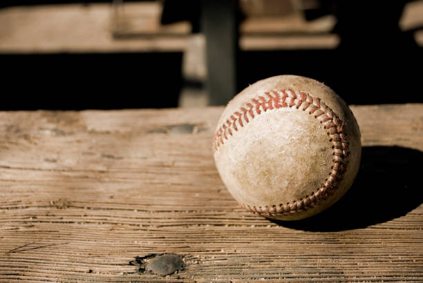 Baseball on bench A baseball on a bench.Other images of Baseball: wooden bleachers stock pictures, royalty-free photos & images