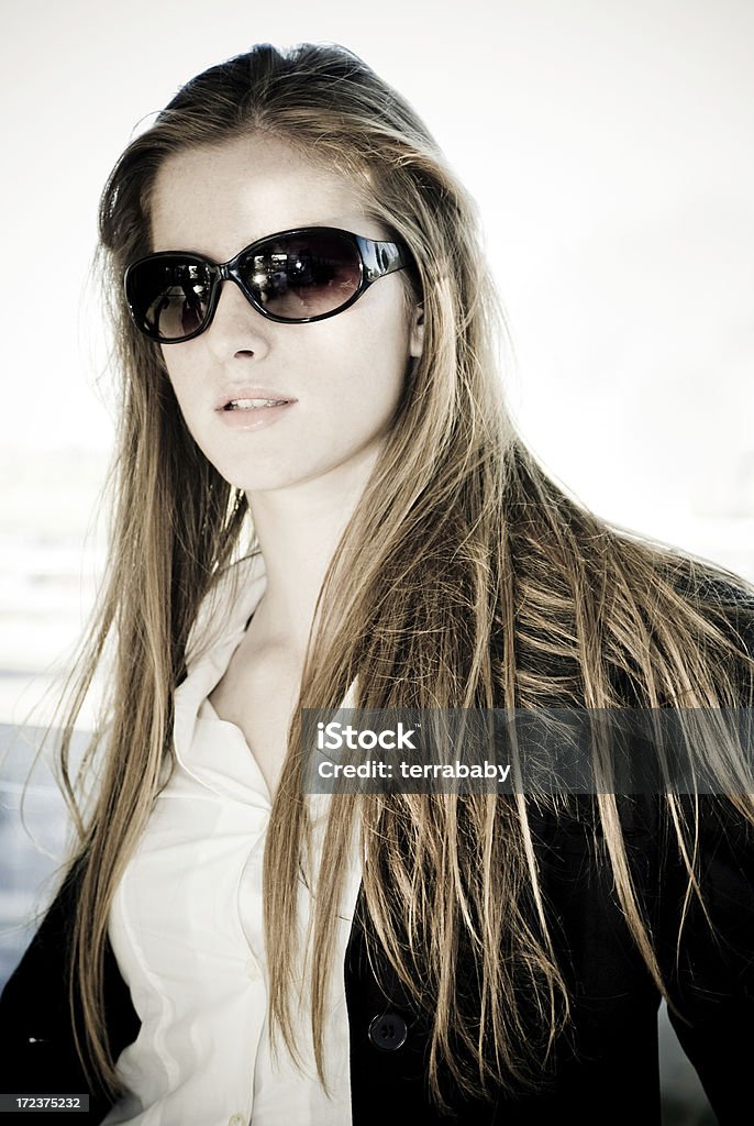 Beautiful Girl portrait of beautiful young blond girl with cool sunglasses. from istockalypse barcelona. Adolescence Stock Photo