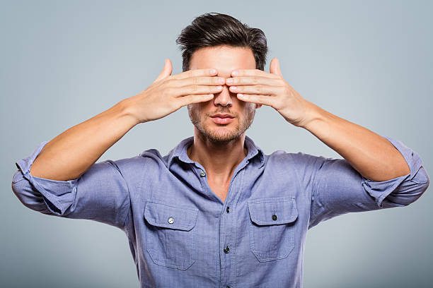 istock Young man covering his eyes 172375794