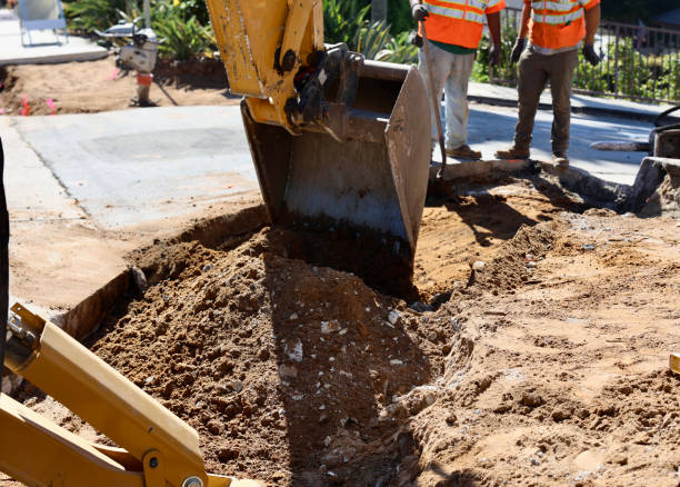 istock Road crew operating heavy equipment replacing the sidewalk 1723765308