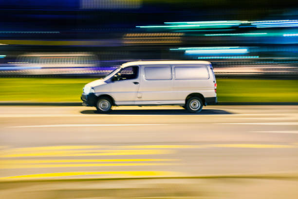 istock Motion blurred image of van going fast through city street 172377096