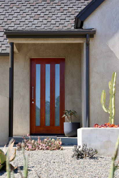istock Desert landscape on a beach bungalow with a modern mahogany front door 1723774356