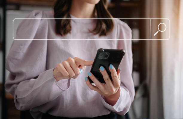 istock Searching Browsing Internet Data Information Networking Concept with blank search bar.woman working with mobile phone and laptop computer VR icon 1723779296