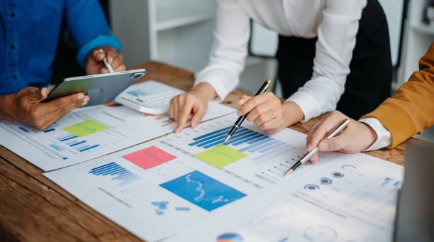 istock Business People Planning Strategy Analysis Office Concept. writing notes about sticky notes Laptop,tablet  Planning and Brainstorming Strategies 1723779901