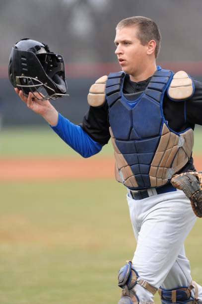istock Baseball catcher headed to dugout 172378351