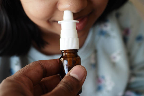 istock close up of sick child using nasal medicine spray 1723783673