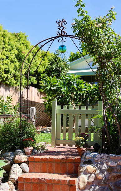Rustic metal trellis is the gateway to the garden
