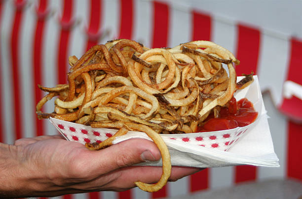 Curly Fries At The Fair Curly fries for eating at the fair curly fries stock pictures, royalty-free photos & images