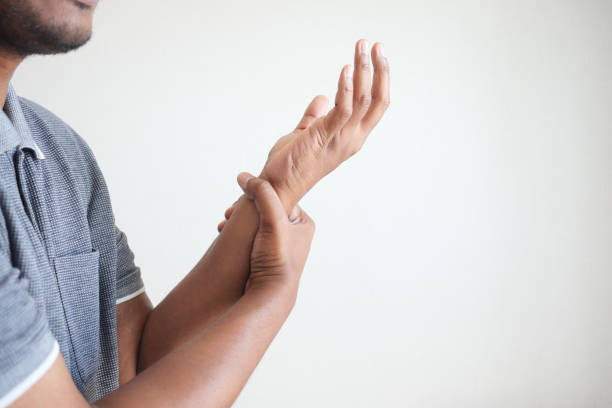 istock man suffering pain in hand close up 1723804508