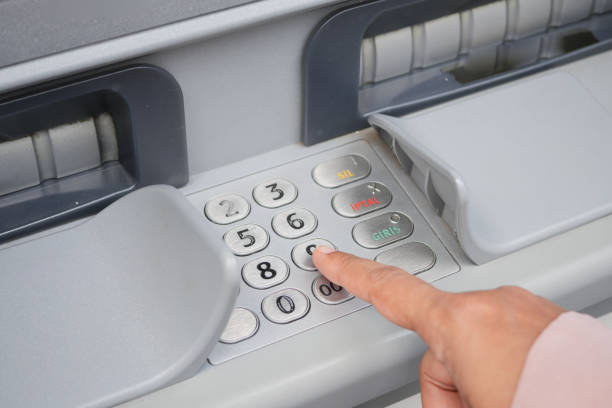 istock close up women hand pressing on atm machine, 1723806640