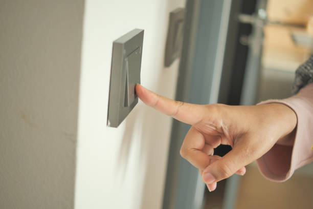 istock women finger turning on lighting switch . 1723813086