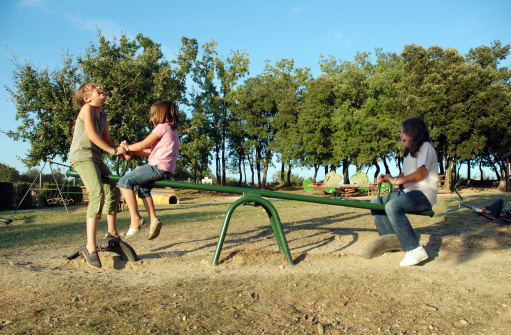 Children playing at playground area.More at:Children groups (three or more) Lightbox: