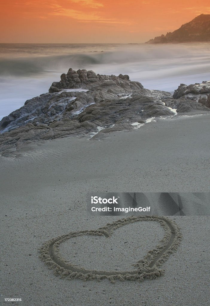 Heart on the Beach A heart drawn on a beach at sunset. Affectionate Stock Photo