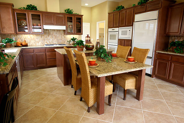 Kitchen A beautiful kitchen and breakfast table, with granite counters, designer appliances, and a tile backsplash. View other Home Decor Images here. breakfast room stock pictures, royalty-free photos & images