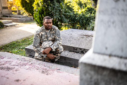 Soldier feeling sorrow and pain for his dead friend.