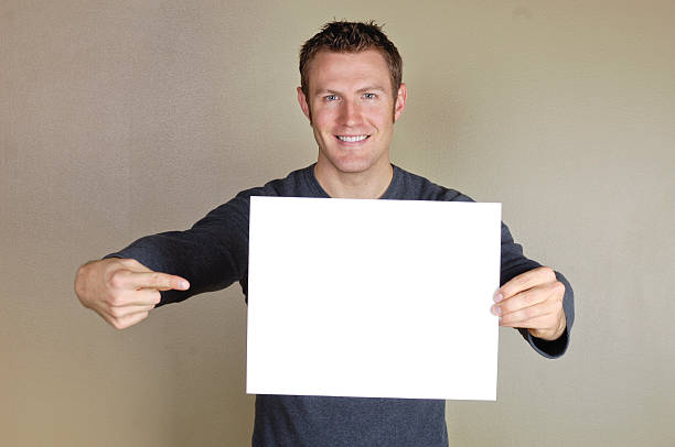 istock Signs - Handsome man holding blank white sign. 172384204