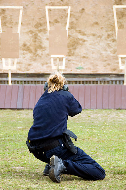 Woman practice shooting stock photo