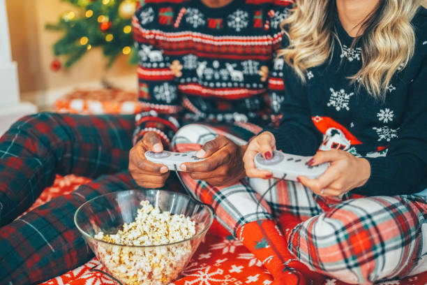 istock Happy couple on Christmas playing video games 1723843155