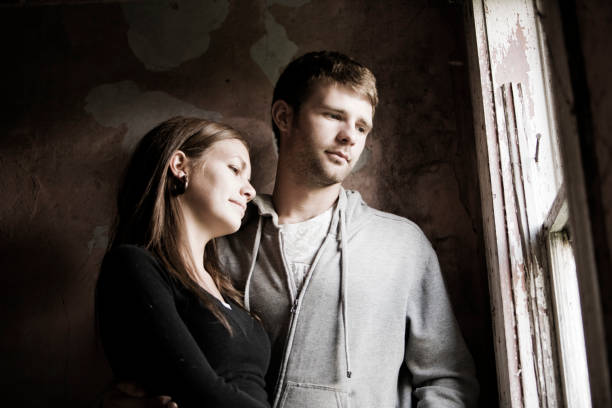 istock Couple looking out the window 172384395