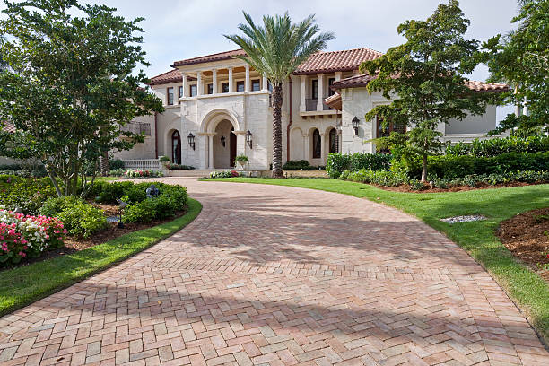 Estate Living Brick pavers leading up to this beautiful estate home in Florida. mansion stock pictures, royalty-free photos & images