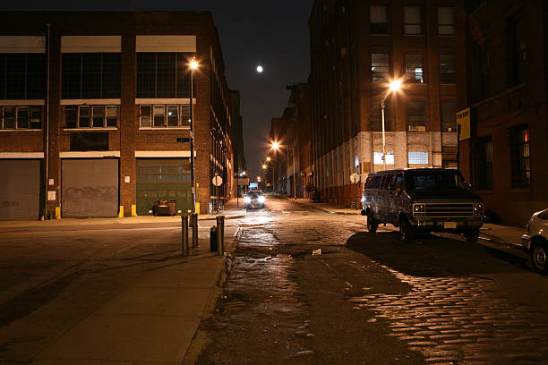 istock Deserted Brooklyn DUMBO Cobblestone Backstreet at Night Full Moon 172385097