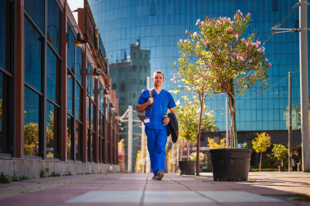 istock Healthcare worker walking in the city after work 1723851282