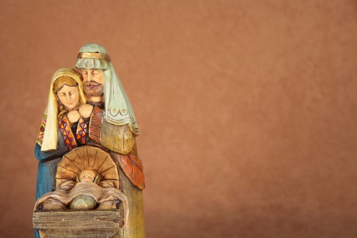 Nativity trio of Joseph, Mary, and Baby Jesus with copy space. Horizontal image for Christian or religious Christmas use. 