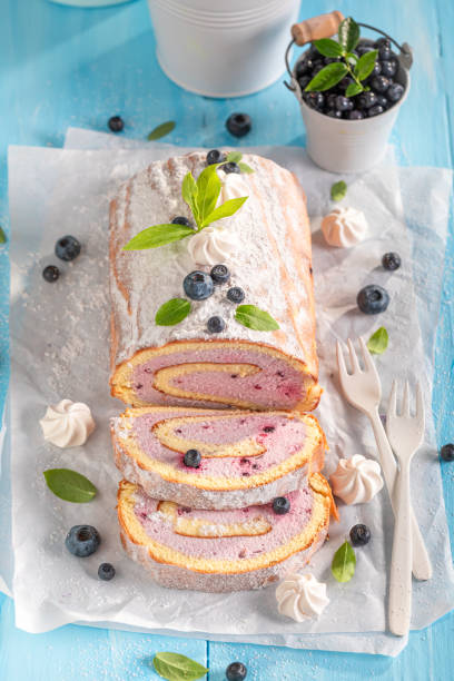 Tasty blueberry swiss roulade served as spring dessert. Tasty blueberry swiss roulade served as spring dessert. Mango swiss roll with berries and caster sugar. 2632 stock pictures, royalty-free photos & images