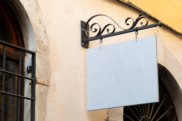 istock Blank suspended sign with wrought iron support 1723866912