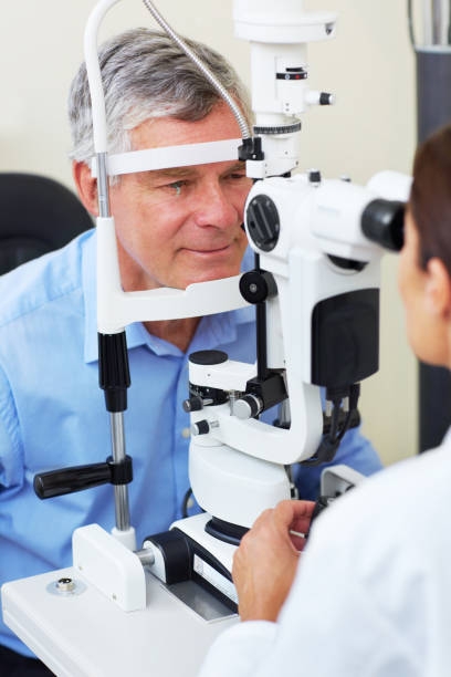 istock Ophthalmologist examining senior man's eyes 172386782