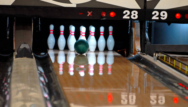 It's a Set-Up! Bowling ball in line for a strike bowling alley wood stock pictures, royalty-free photos & images