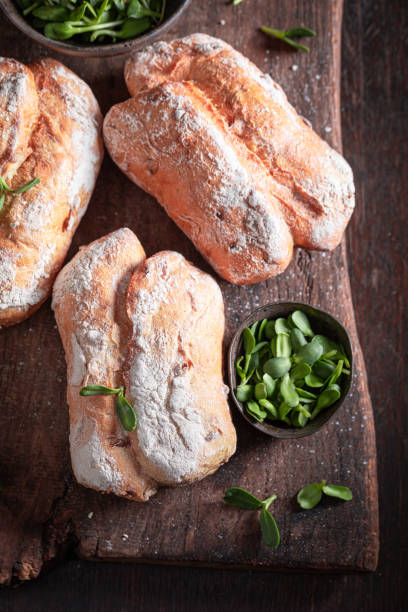 istock Fresh sprouts buns freshly baked on wooden board. 1723870191