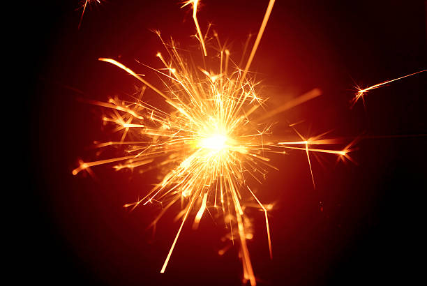 Christmas or celebration daisycutter, fire-cracker, sparkler... yellow glow on red