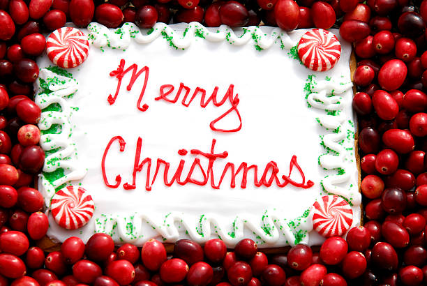Merry Christmas Cookie Greeting with Cranberries stock photo