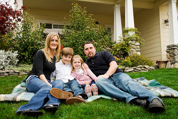 istock Happy Young Family in Front Yard 172387739