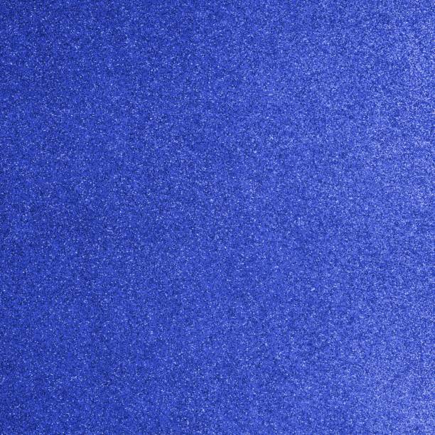 istock BLUE background with bright reflections and many small lights 1723880356