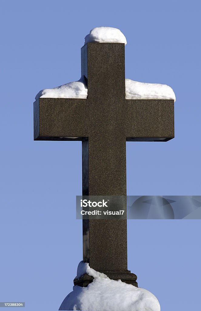 cemetery cross in the snow cemetery cross covered with snow Blue Stock Photo