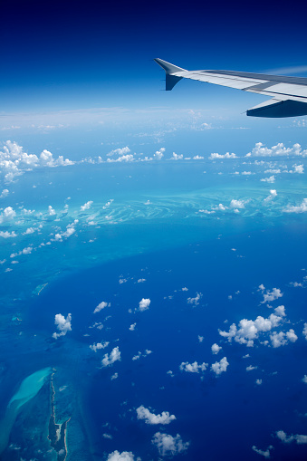 view of the Caribbean from an airplane window
